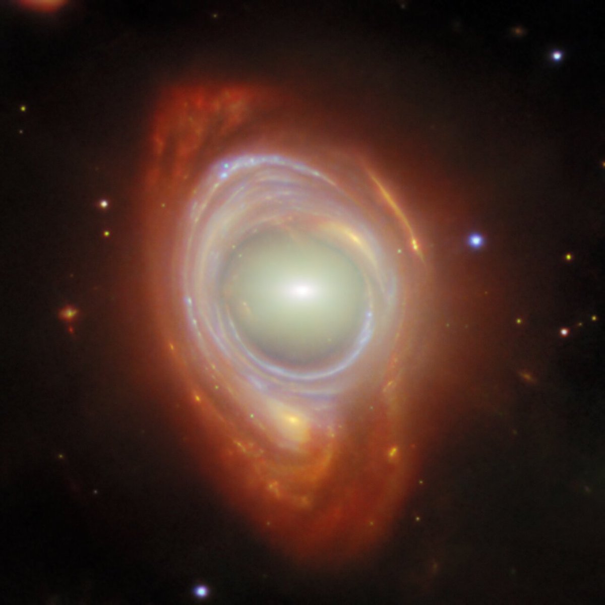 What looks like one galaxy is actually two, separated by great distances. This rare illusion, called an Einstein ring, occurs when light from a distant galaxy is bent around a closer one—creating a glowing halo. 

More: esawebb.org/images/potm250…
📸: <a href="/NASAWebb/">NASA Webb Telescope</a>