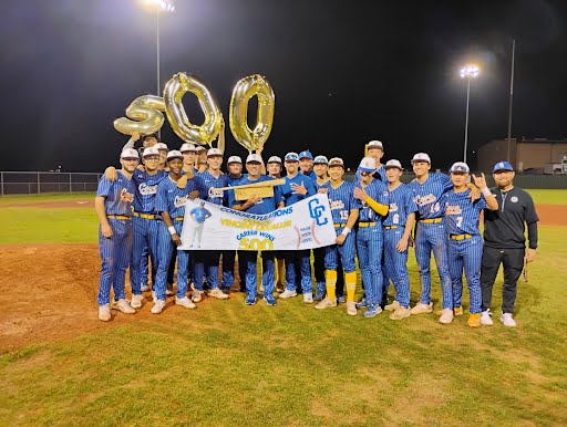 Cove players celebrate with coach Vince Lavallee, who earned his 500th career win in a 2-1 victory over visiting Harker Heights