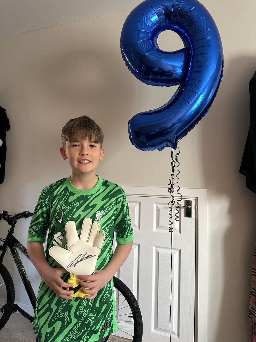 Hambodinho's tweet photo. My boy is buzzing with his @Alissonbecker birthday haul. Biggest fan ❤️ #LFC https://t.co/0EoNtTkrac