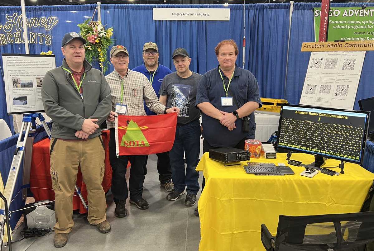 Setup crew for CARA's amateur radio community booth at the 2025 Outdoor Adventure and Travel Show at the BMO Centre in Calgary.  
L-R:  Craig Marceau VE6WIN, Ken Smith ?, Jukka Lindewall VA6LIN, Doug Howard VE6CID, Peter LaGrandeur VA6RPL.