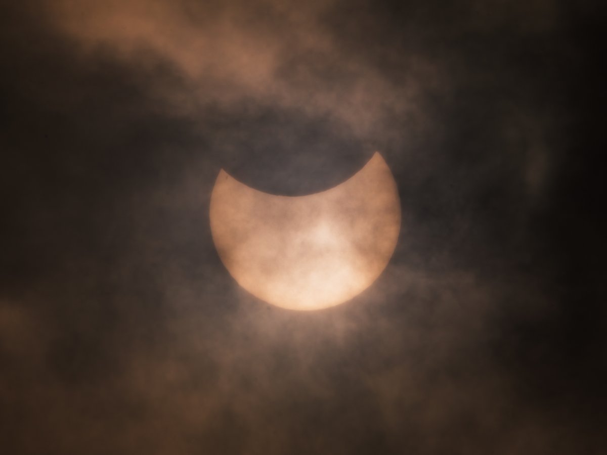 Against all odds, I was able to catch a glimpse of the partial solar eclipse in the cloudy Dublin sky shortly after its peak in the recent hour.
