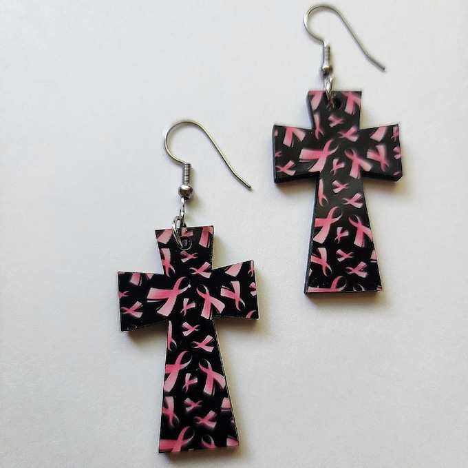 DlovCreations's tweet photo. Pink Ribbon Wooden Cross Dangle Earrings.  light weight hard board. 1.5 x 1.0. Hypoallergenic ear wires. One sided design. Pink ribbon print design. Wear your awareness. Nice gift. https://t.co/awEqEMSuqM https://t.co/WwRfNJkjrp