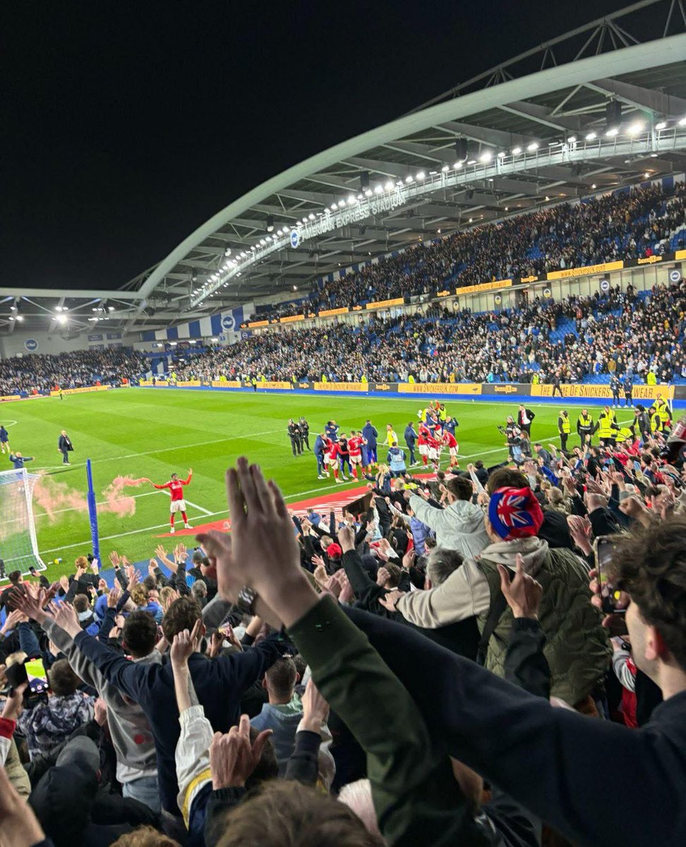 Quality pic of Nottingham Forest players celebrate with fans after their win away at Brighton today to earn a place in the FA Cup Semi Finals! 👏

Check Elanga with the pyro… 🧨🤣