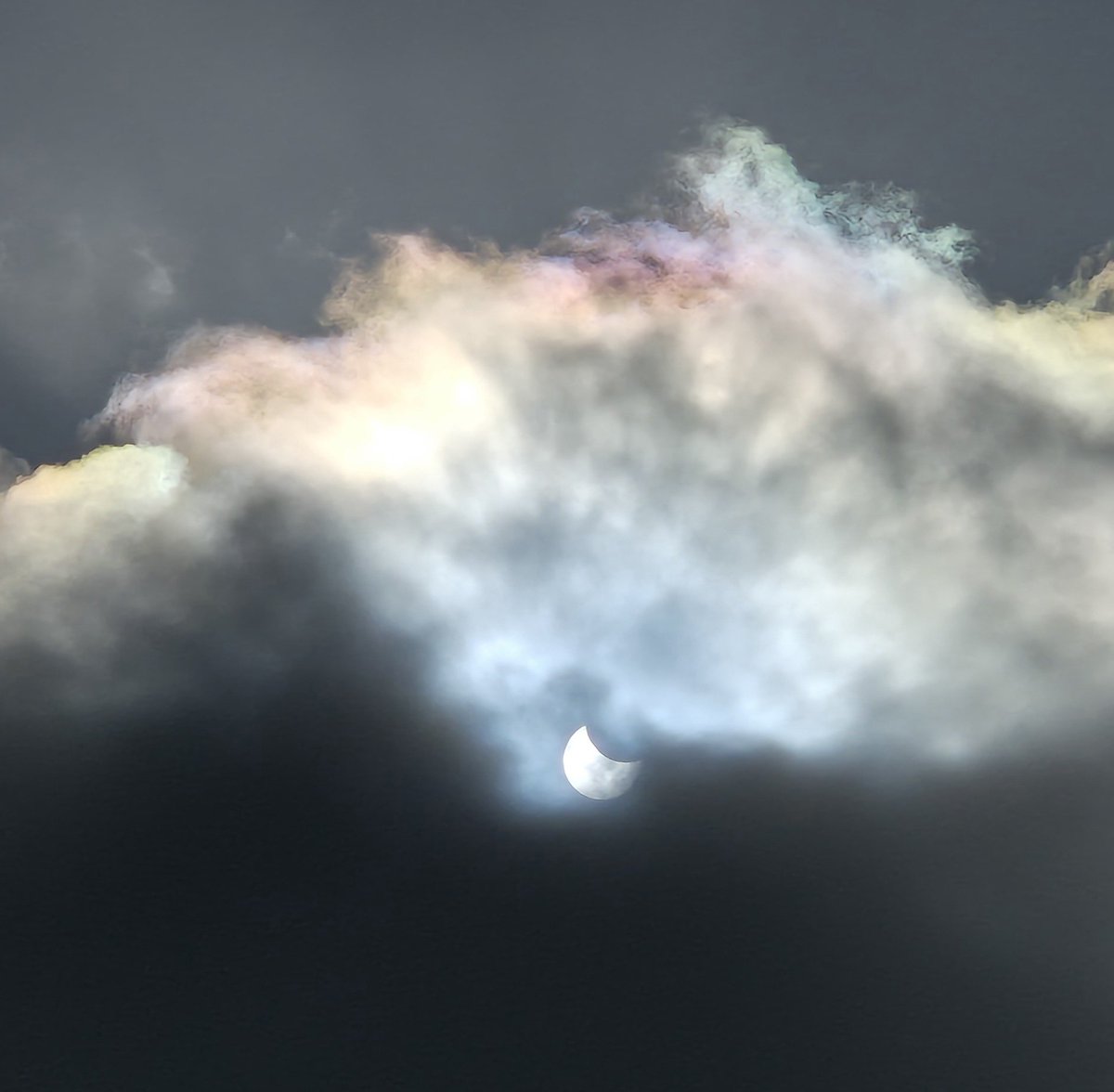 Ozymandiasdust's tweet image. The clouds sail by echoing the universe, its movement, swirling nature, and vastness. We look up beyond our little planet and glimpse, for a second, infinity, and the inconsequence of humanity... 🌙 #EclipseSolar #Devon #Eclipse #EclipseSolar2025