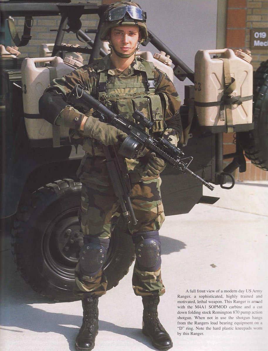 US Army Ranger using BETA-C drum on M4A1 rifle, 2001 period. Also note that he is using an M870 shotugn.