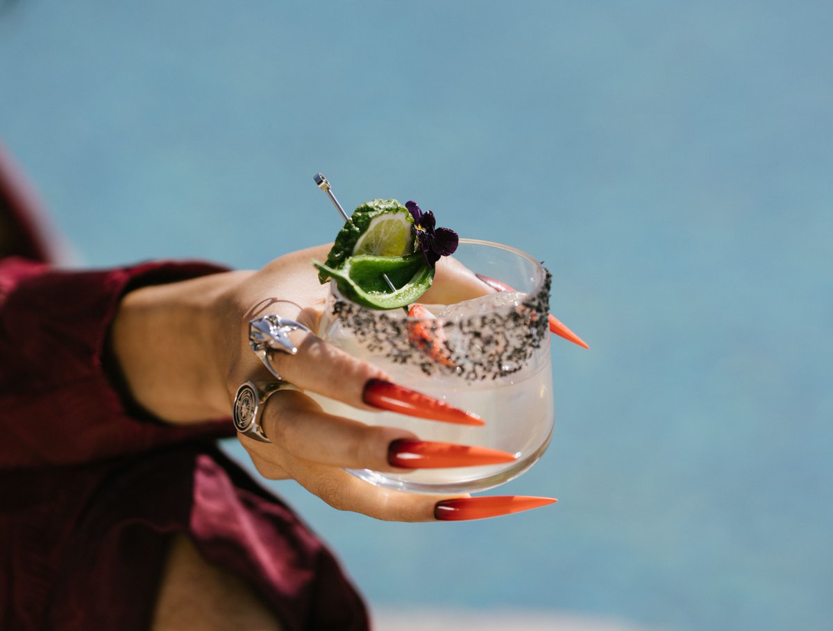 A cocktail in one hand, sharp instincts in the other. #UnDomesticate