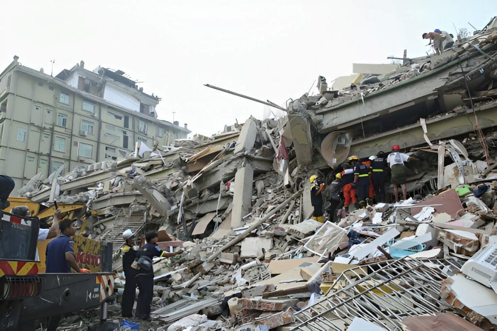 The smell of decaying bodies permeated the streets of Myanmar’s second-largest city on Sunday as people worked frantically by hand to clear rubble in the hope of finding someone still alive, two days after a massive earthquake struck that killed more than 1,600 people and left