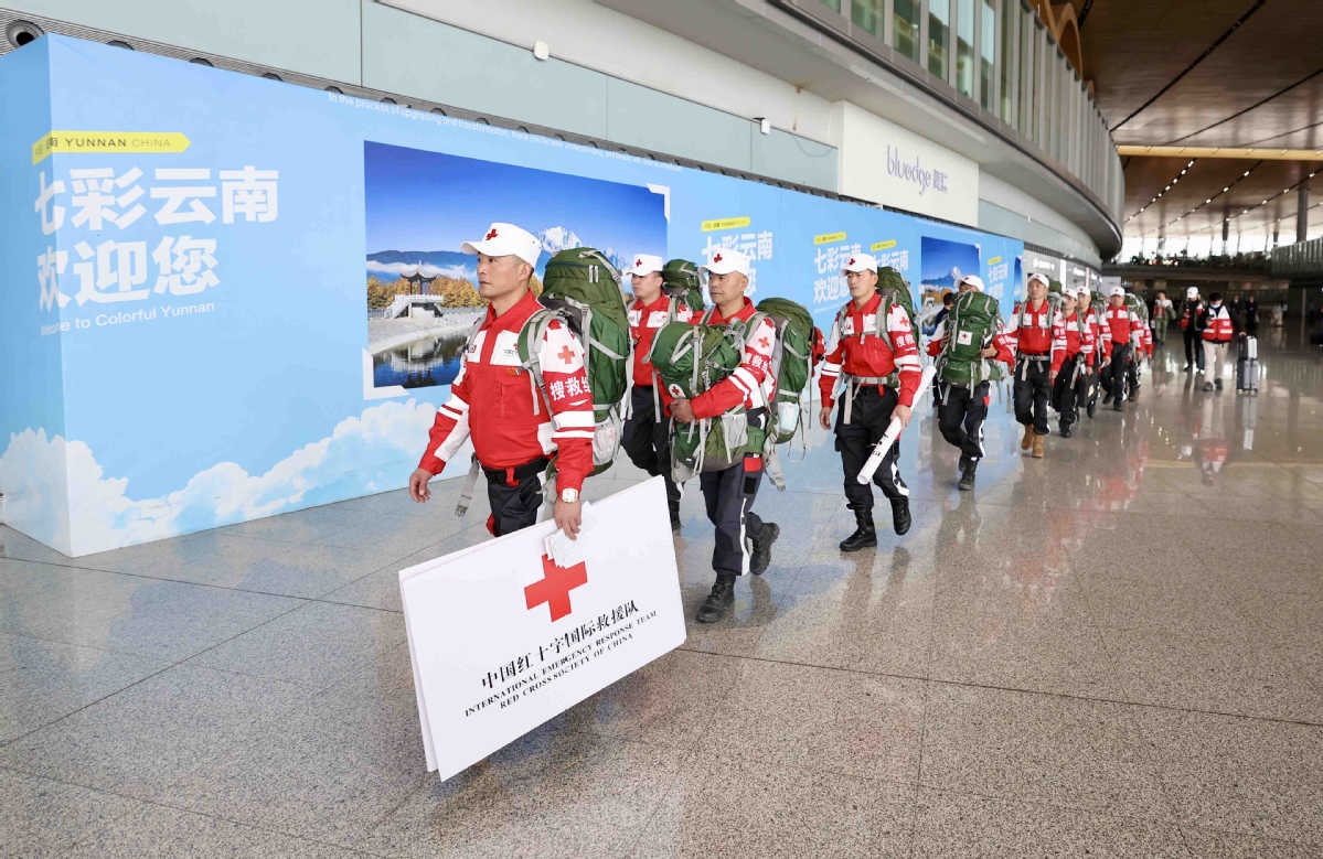 China_says's tweet photo. An international rescue team dispatched by the Red Cross Society of China stands ready at Kunming Changshui International Airport before departing for Myanmar on Sunday. (Photos courtesy of https://t.co/XQIPzf2AHR) https://t.co/pDvbs6BeNK