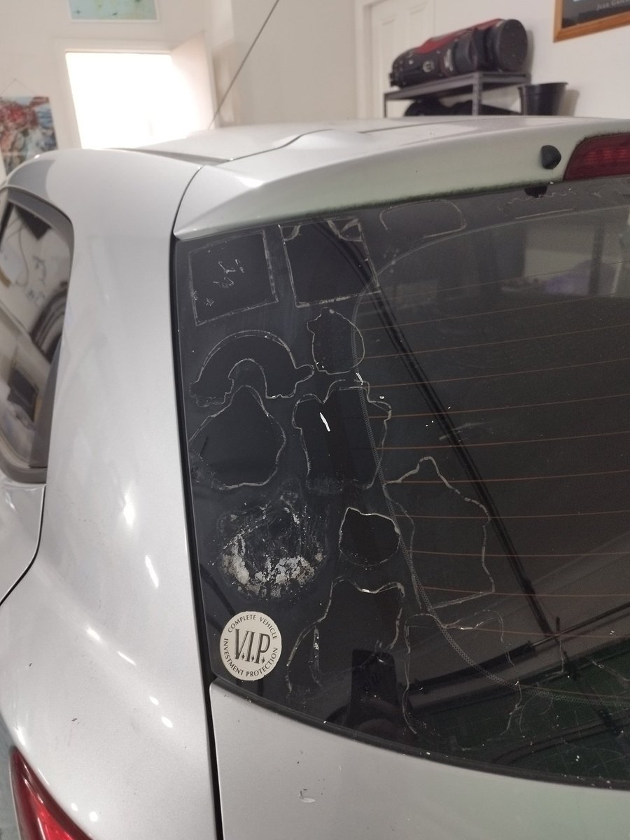 Cleaning my car up to sell and we had to get the heat gun out to get all the #CatsOfTwitter stickers off 😭 I told Tom everyone's name as we removed them
