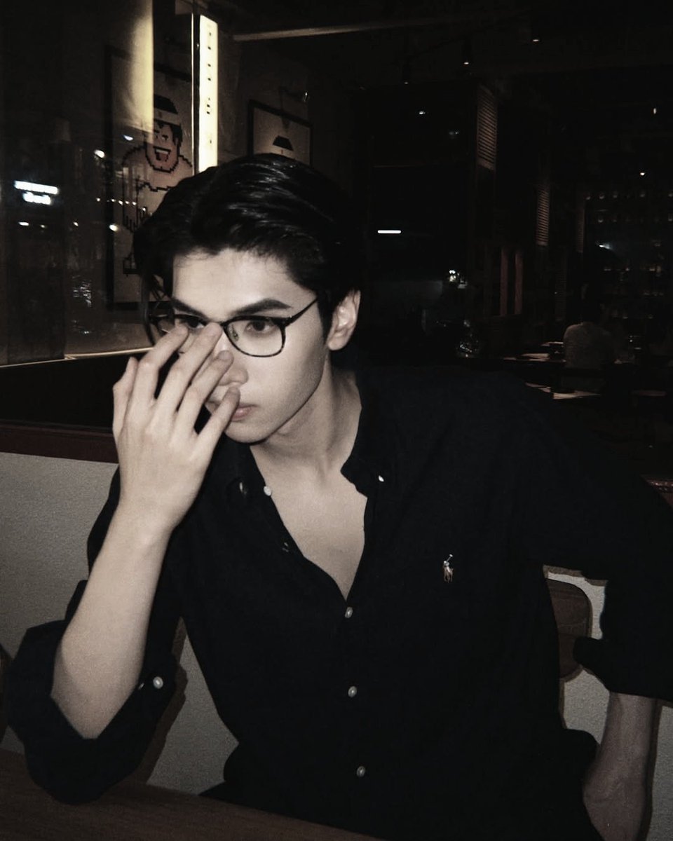 I might look like I’m planning my next big move, but really, I’m just waiting for dinner—soaking in the cool night vibes that match the mood and the fit.