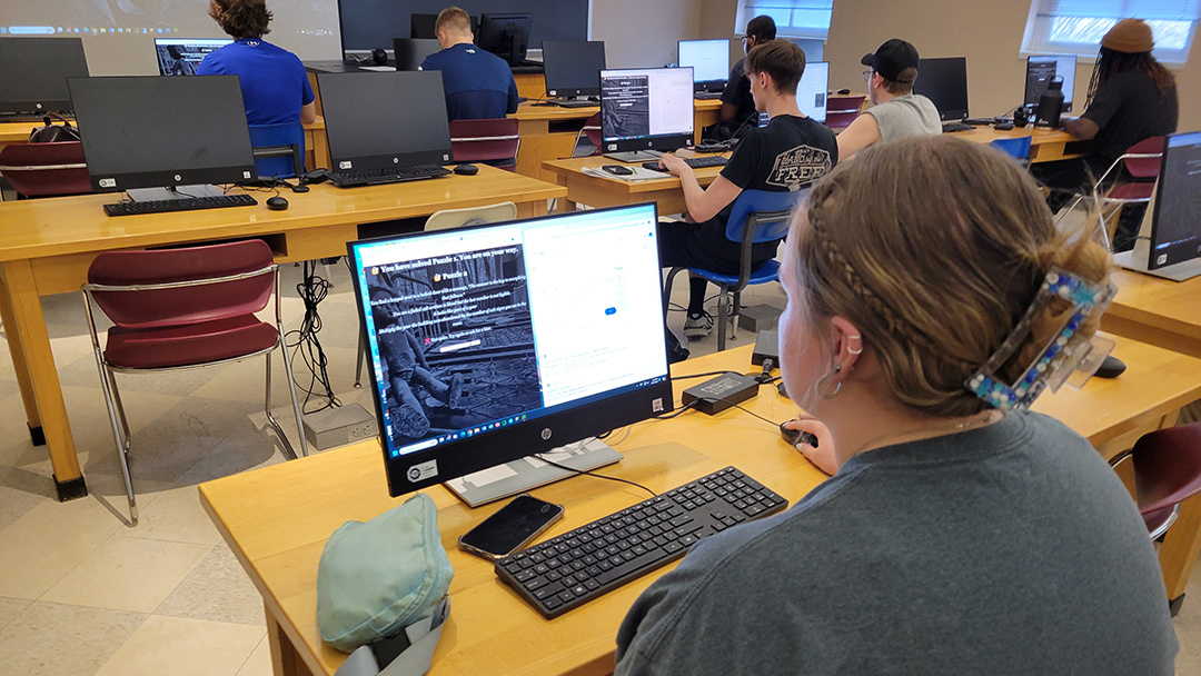 CSC1853's tweet image. Students in Culver-Stockton College (C-SC) Data Analytics Professor Joseph Liesen's artificial intelligence class put their problem-solving skills to the test in an AI-generated virtual escape-room challenge. Congrats to winner, Sarah Pickett-Miller, a sophomore psychology major!