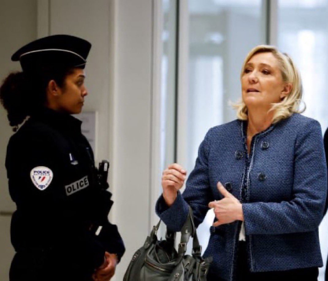 Marine Le Pen leaving court today after finding out that she has been banned from running for president in 2027 and will spend 2 years in house arrest with an ankle monitor