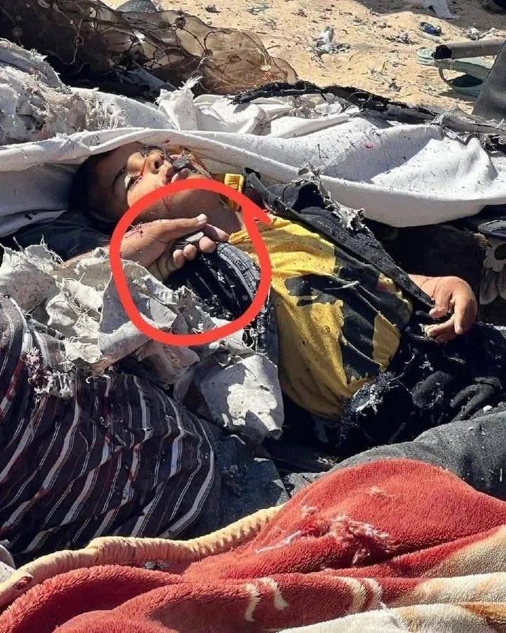 Children wearing Eid clothes and their father holding Eid money to distribute to them.

An entire family was killed when Israeli warplanes bombed a tent housing displaced people west of Khan Yunis, in the southern Gaza Strip.