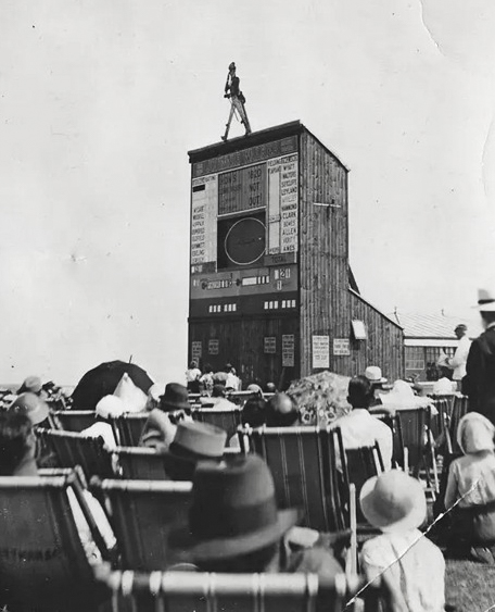 In the 1934 Ashes summer such was the interest that Johnnie Walker (the whisky brand) erected giant scoreboards at half a dozen beach resorts - this one was at Folkestone - so holidaymakers could spend the day following play which was updated by ball-by-ball telexes