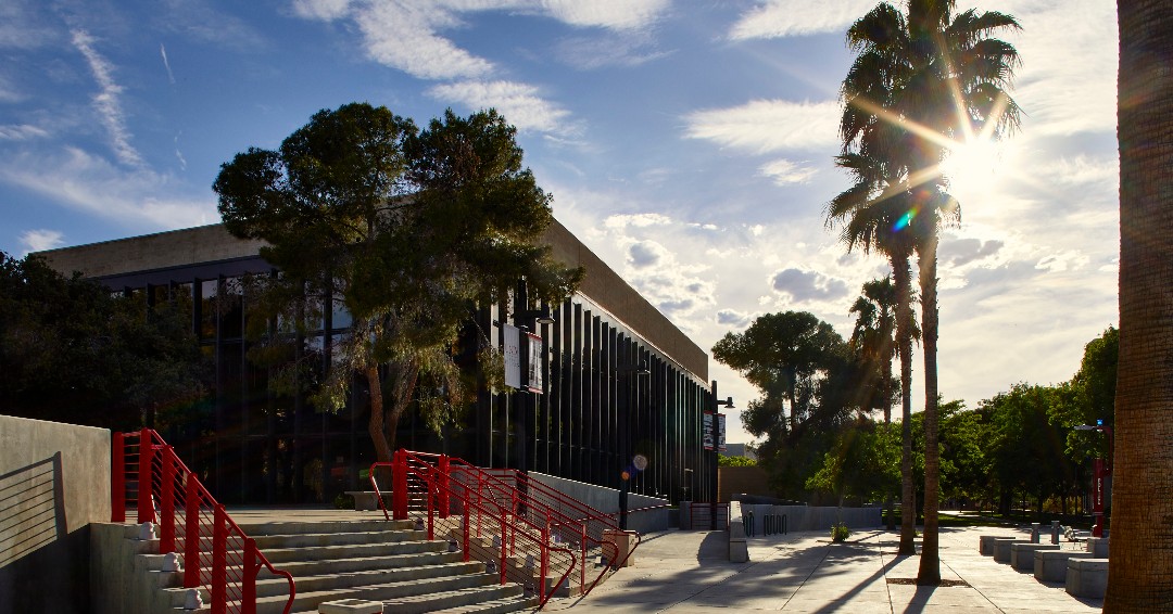 Golden hour hits different at UNLV ✨🌅 

📸 : Sunlight flaring through palm trees in front of a building

#UNLV #RebelsMakeItHappen #UnlvBound