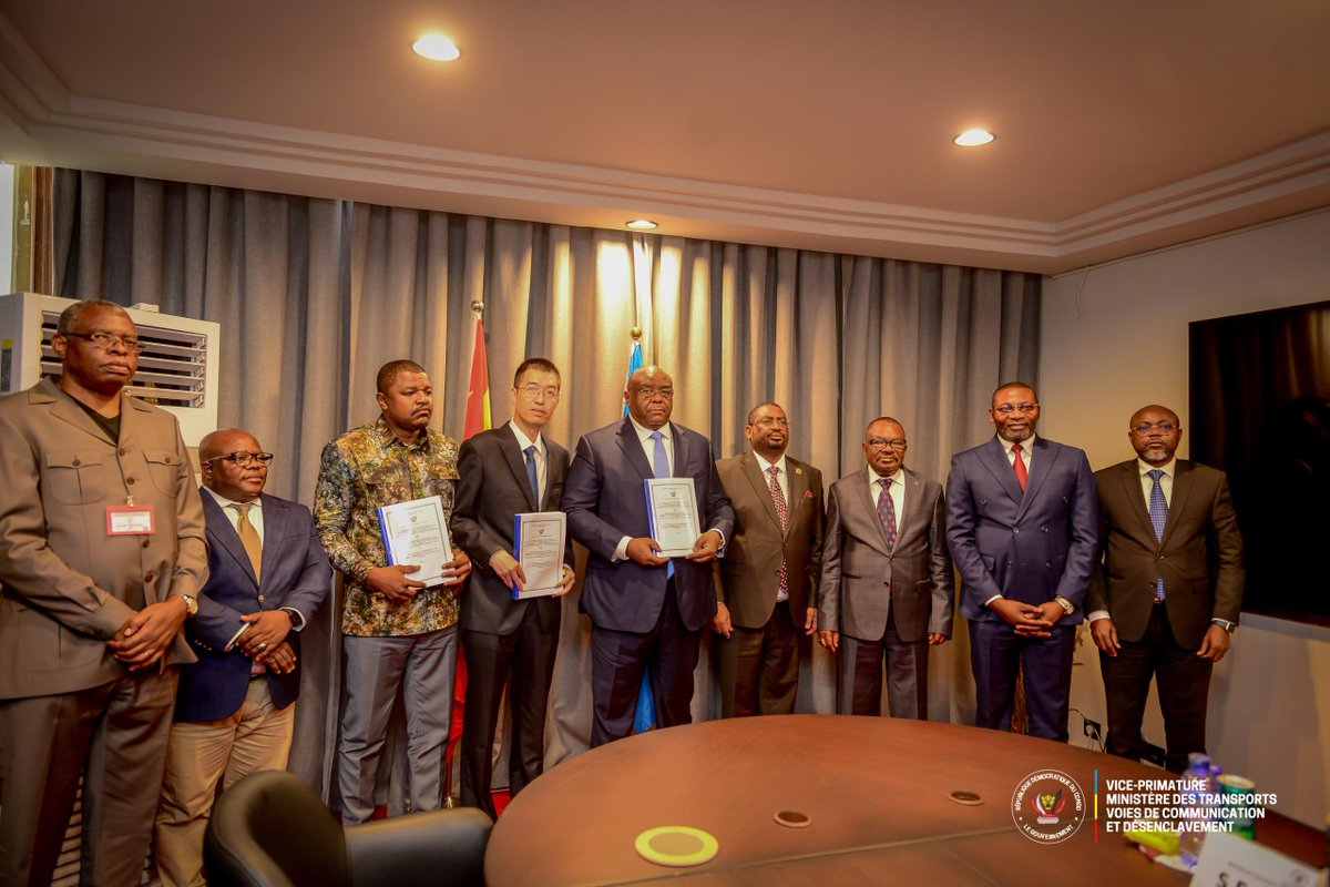 FloryOKANDJU's tweet photo. Yesterday in Kinshasa, DRC, I had the honor of witnessing the signing ceremony of a contract between the government of the DRC, represented by H.E. Vice Prime Minister and Minister of Transport, Ways of Communication, and Opening Up, @bembajp , along with the Ministry of Infrastructure and Public Works, and JINTAI Mining Ltd in joint venture with TEMBO MAJENGO Company. The contract covers the financing, construction, operation, and maintenance of an industrial port in Kalemie, a critical infrastructure link for the Central Corridor region.