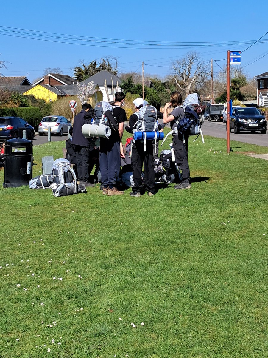 All groups have stopped  for lunch on Burton Village green.