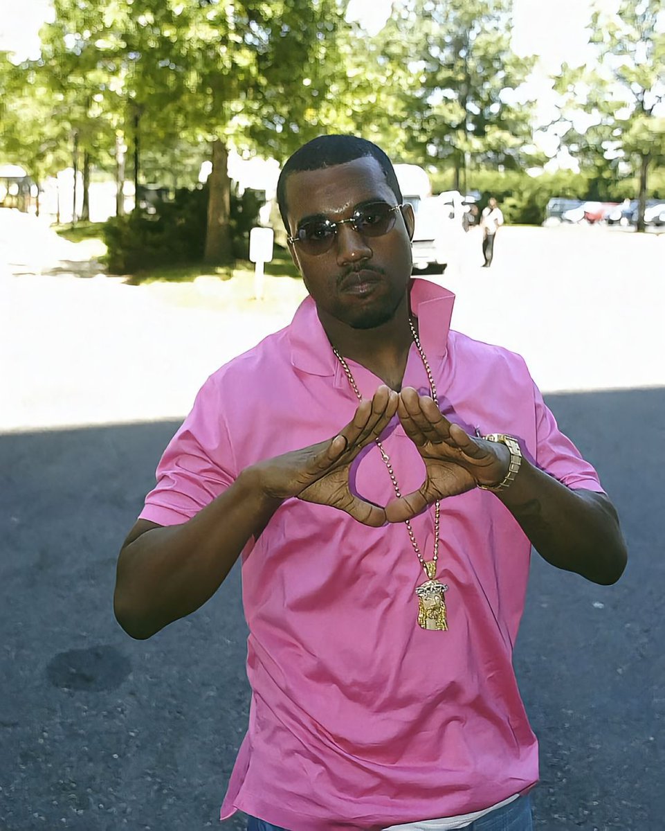 Ye with the iconic pink polo shirt