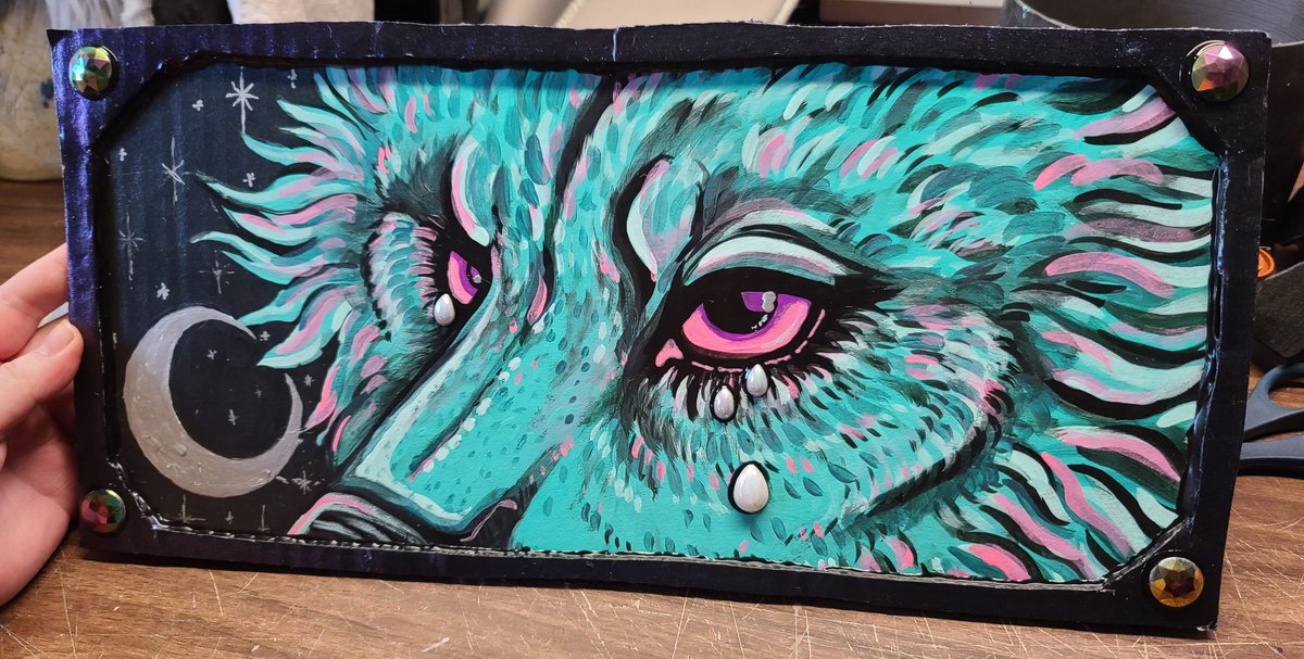 Not sure if anyone is interested but I have this little painting I did up for sale for some spare monies since I'm still slow with working after my surgery.
Acrylic on cardboard &amp; sealed with semi-gloss with some gem tears &amp; corner stones.

Idk $100 or best offer? DM me to claim!