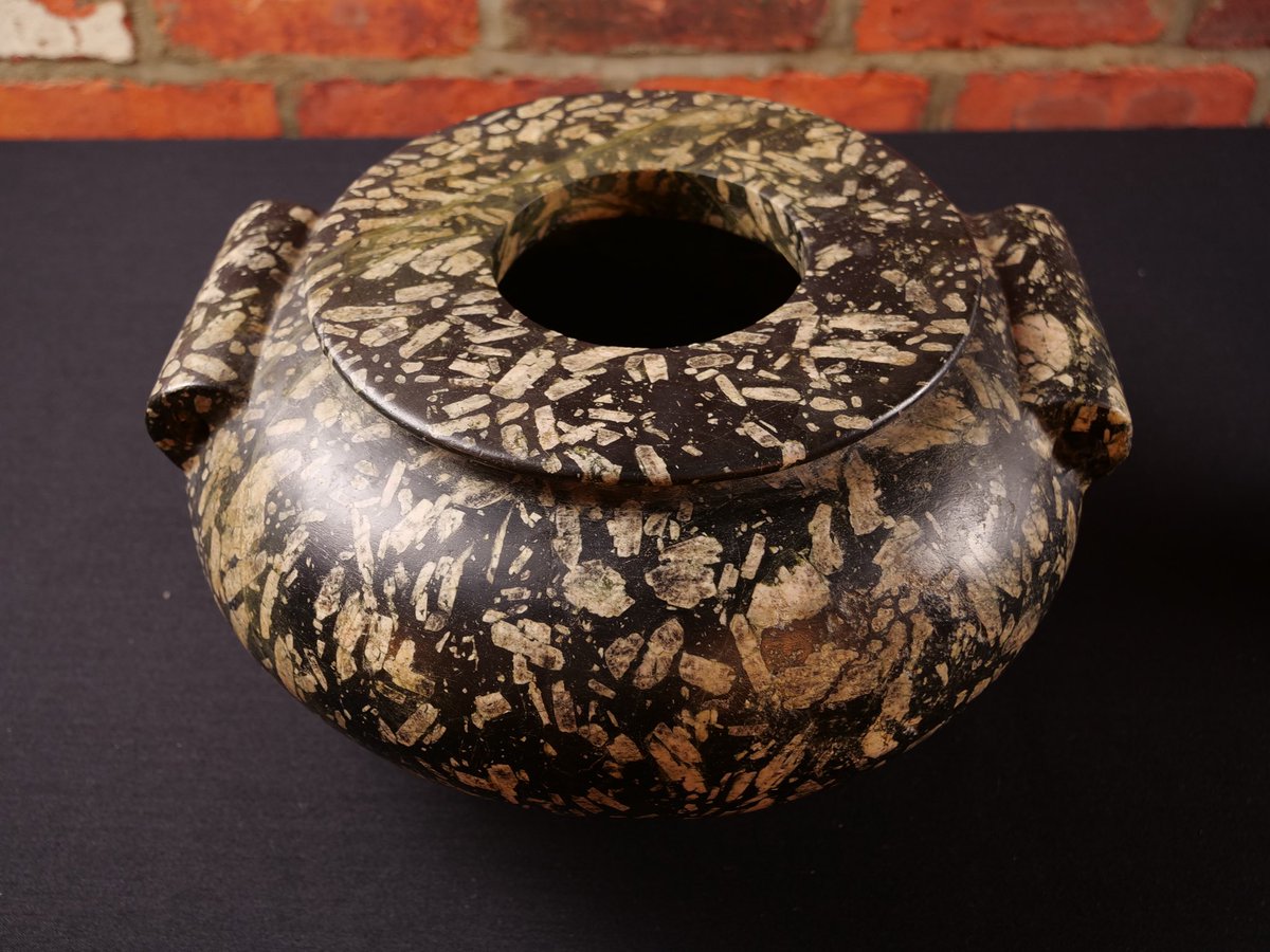 ArtifactFNDN's tweet image. This brilliant lug vessel is made from trachyte porphyry, a rare volcanic rock found near Mount Kilimanjaro. The large feldspar crystals would have made this incredibly challenging to create. Discovered in a 5,200 year old burial, there are very few of these left in the world.