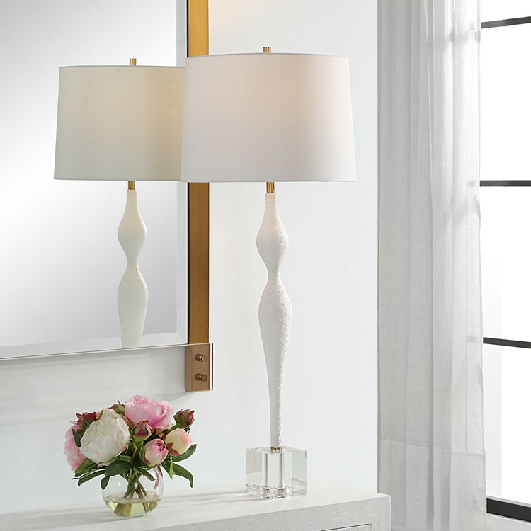 Shop <a href="/LampsPlus/">Lamps Plus</a> for fast, free shipping on our curvaceous new Helena Table lamp from #uttermost. Slender chalk white base with plaster like texture is balanced with a chunky crystal base. lampsplus.com/products/helen… #carolynkinder #hpmkt