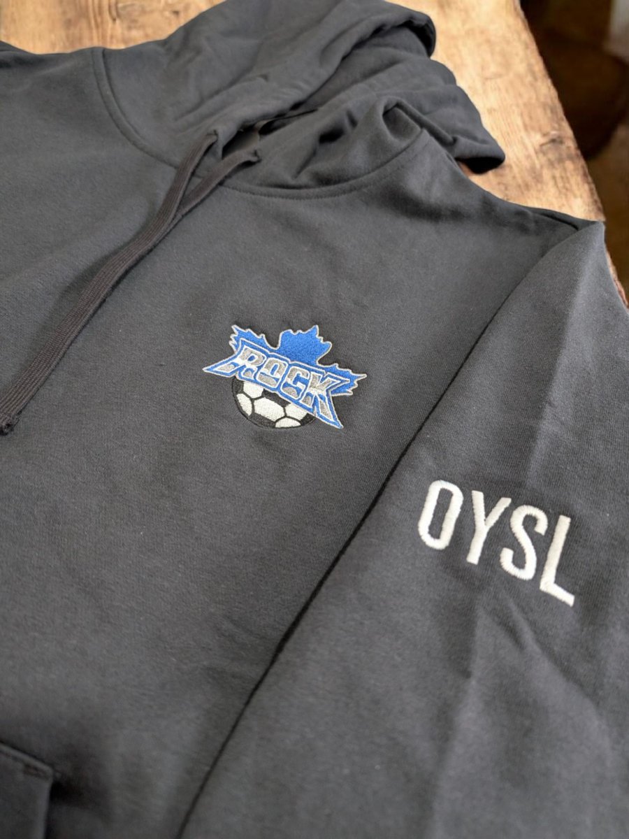 customcapsca's tweet photo. Show your team's spirit with a custom hoodie! Perfectly embroidered ROCK inspired logo &amp; OYSL detail, crafted just for you.  #EmbroideredWithPride #CustomCapsCanada https://t.co/ZvHglW7lrS