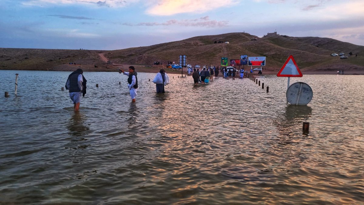 NajibSadid's tweet photo. #Pashdan dam in #Herat #Afghanistan is receiving more water from Karukh River. People are crossing the part of Herat-Maimana highway for the last time as the road & the bridge are inundated. 👇recent images from Pashdan dam by @ehherawi. https://t.co/hyL0j3FzTF