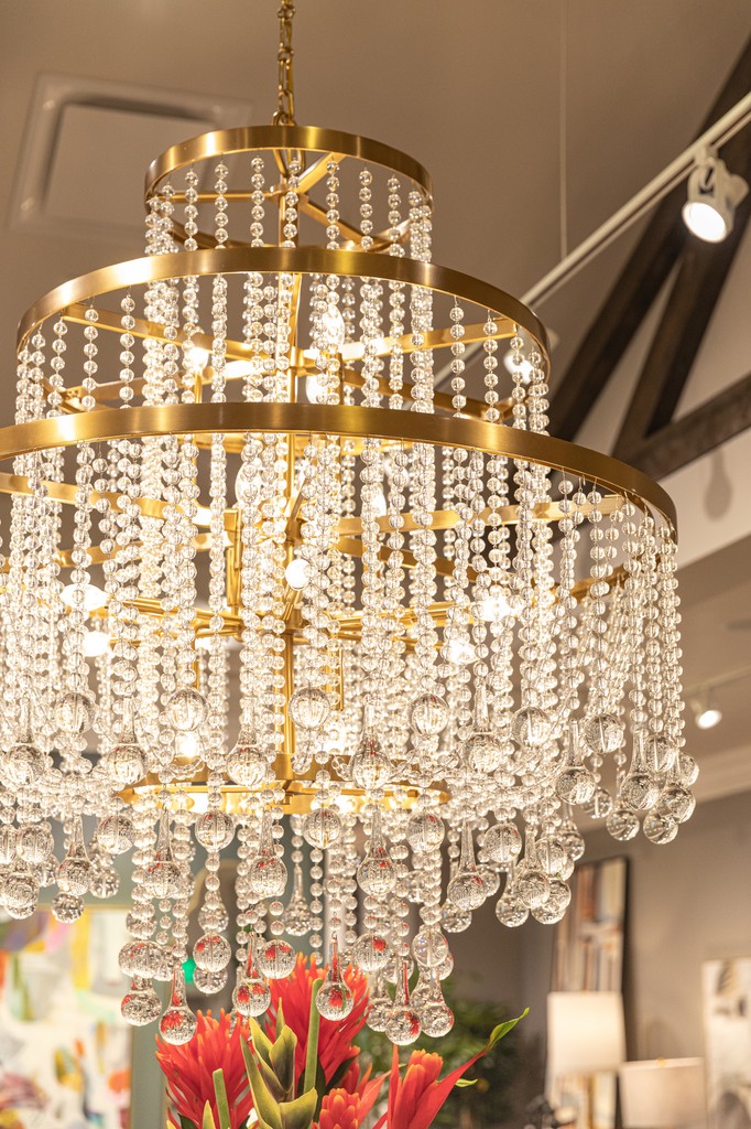 Our beautiful Luna 15-light chandelier decorates this display at Nebraska Furniture Mart! Luna uses three tiers of lights surrounded by cascading curtains of crystal to create a boldly beautiful look. It is lovingly finished in warm brass.

#SavoyHouseLighting