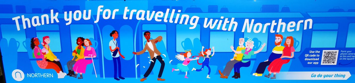 Here's the reality of this idyllic scene.

The women on the left are off on a hen do and have been drinking for four hours. Their shrieks, howls and guffaws drown out everyone else.

The conductor and guy stood up are just waiting to be racially abused by some drunk idiot.

1/2