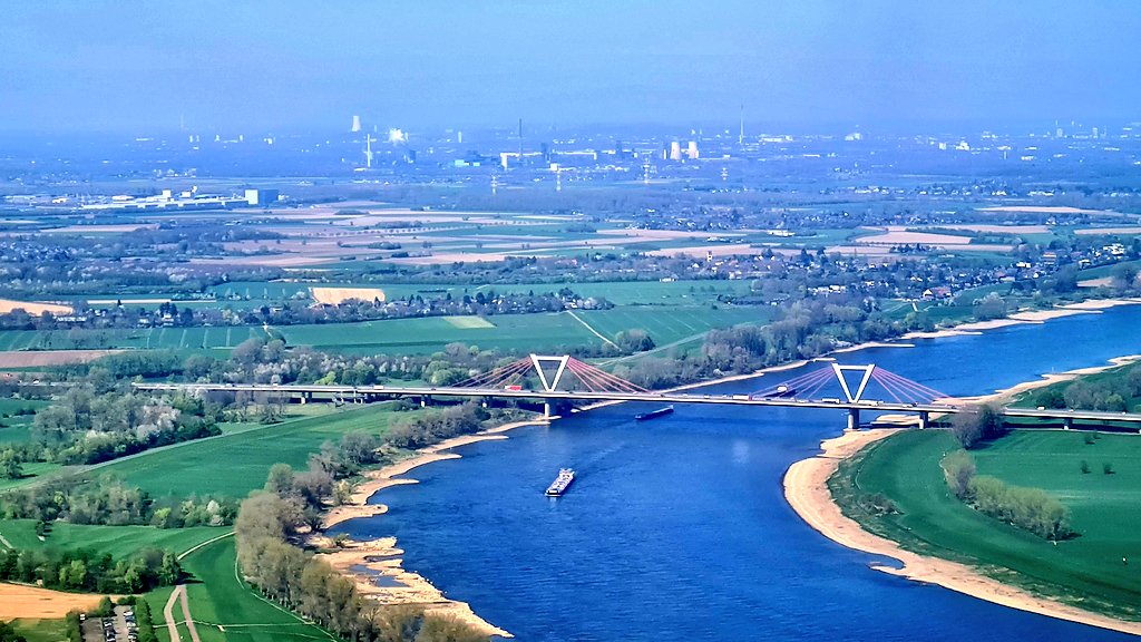 Smoking chimneys and on shore windfarms.

Immaculate fields and well used waterways.

And of course, on of the highest densities of football pitches per head of the population one can find.

This is Germany!