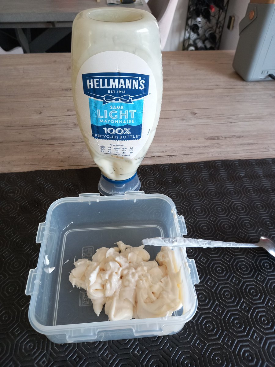 This is how much mayonnaise Mom was able to get out the horrible non bendy plastic "empty" Hellmans bottle with lots of shaking &amp; a long handled spoon - it's so hard to use when full as well.  Can't cut it with scissors.