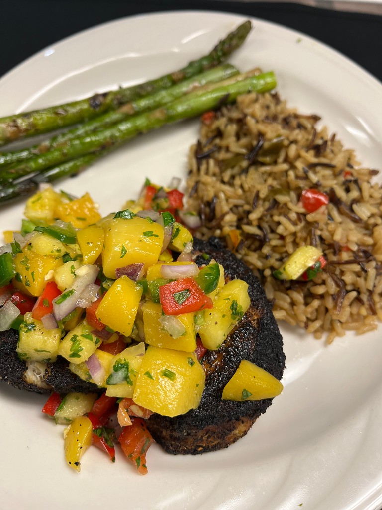Cajun pan seared Blacktip Shark fillet with a pineapple, peach, fresh jalapeño,
cilantro, and red pepper salsa. Served with rice and asparagus. Delicious and unique entree special at Knight’s Downtown this weekend.