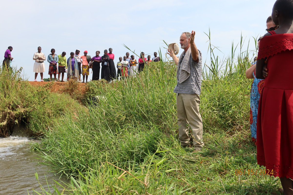 GoCorps's tweet image. "There are no baptismals or troughs in rural Uganda. Instead people find the nearest stream to display their commitment to Christ through baptism. Here you can see a group praying before baptisms." -Neika, Goer Class of 2023, Youth Development Track