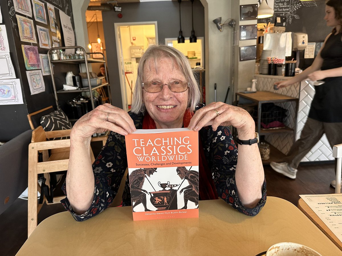 One of my great friends and teacher colleagues, Gill, proudly holding a copy of Teaching Classics Worldwide at Stir 🧁. Updates to countries can be found in my website. <a href="/BloomsburyClass/">Bloomsbury Classical Studies & Archaeology</a> <a href="/CamEdFac/">Faculty of Education, University of Cambridge</a> <a href="/classicsforall/">Classics for All</a>