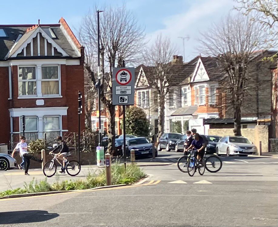 A sunny afternoon in the quiet ‘village square’ of our LTN: two boys playing football, a few more messing around on bikes. #HealthyStreets at their best.💚Wonder how these kids feel about <a href="/EnfieldCouncil/">Enfield Council</a> soon opening up these filters to 1000s of drivers via ANPR? <a href="/JourneysPlaces/">Journeys and Places Enfield</a>