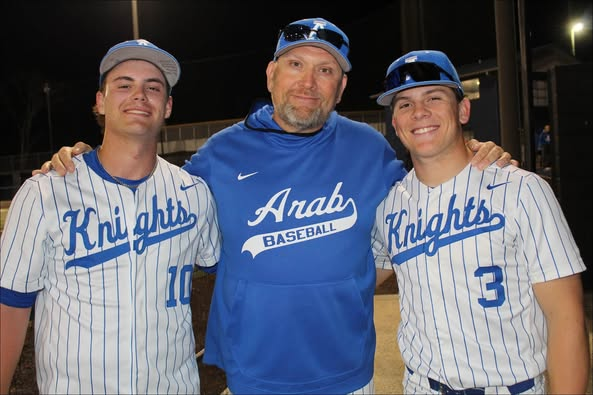 ahsaaradio's tweet photo. AHSAA Baseball Spotlight presented by Majestic Caverns - https://t.co/1MdWAvsIZl
AHSAA BASEBALL SPOTLIGHT
Arab, Cullman Baseball Coaches
Collect milestone 500th career Wins
MONTGOMERY – Cullman High School baseball coach Brent Patterson and Arab High School baseball coach Chad Hudson each recorded the 500th victory of their coaching careers last week to share this week’s AHSAA Spring Boys’ Sports Spotlight.
For Hudson, the 6-4 win over New Hope last week was loaded with plenty of drama, however.
Veteran announcer Archie Anderson of WRAB Radio explained.
“For starters, umpire Greg Tanner was struck by a wayward pitch during pitching warmups. He began the game, in the second inning, Tanner’s blood pressure dropped suddenly which sent him to the locker room and then to Crestwood Hospital in Huntsville where he was released around 2 o'clock the next morning. He said later an oncoming virus was more than likely the culprit and not the errant pitch.”
A replacement official took his place, and the game continued.
With Arab leading 3-2 in the bottom of the 6th, Anderson said the Knights had the bases loaded with one out when Dylan Kirkland smashed a hit to the fence that scored three runs that, as it turned out, gave Arab (13-9) the win. The Knights’ outstanding catcher hit the turf heading into third, however, due to an ankle sprain on the play. He is expected to be back at full strength in a few weeks, Anderson added. Luke Martin got the win striking out eight.
Hudson, whose record improved to 500-326 with the win, told Anderson, “I'm proud of Dylan getting that big hit to blow the game open a little bit and give us a little breathing room. And of course, Luke is our guy on the mound. We know whenever he's on the mound we have a good shot," he said.
Hudson, now in his 27th season as a head coach, has picked up 178 of his wins at Arab over the last 10 seasons. He won 182 at White Plains from 2007-2015, 87 at Saks from 2002-2006, and 87 at Springville from 1999-2001.
"Obviously it means I'm getting on up there in age," Hudson told Anderson. "But I've had a lot of great players and assistant coaches through the years. I'm very blessed to be in a place like Arab. I was talking to (assistant coach) Ridge Watson right before the first pitch that the stands were full again. It's just a great place to coach.”
Patterson’s 500th career coaching win came in a tough game as well with Cooper Loftin hurling a 1-0 win over Jasper in the Class 6A, Area 13 contest. Loftin allowed one hit and struck out seven for the Bearcats (11-11). The lone run came on a solo homer by Bennett Johnson in the first inning. The victory improved Patterson’s career record to 500-233 after the win.
The state’s all-time baseball wins leader, William Booth, now deceased,  compiled a 1,217-519 record at Hartselle from 1987-2024. He passed away after last year’s semifinals. The Tigers fell to Hillcrest-Tuscaloosa in a hard-fought championship series the week of Booth’s passing from an extended illness.
“A lot of people say this, but there couldn’t be any more truth to it — I’ve been surrounded by unbelievable players and coaches,” Patterson told the Cullman Times.  Patterson, who took over the program in 2008. “The memories and relationships are what I’ll take away from all this … that’s what makes this so special. Cullman has supported this baseball program for decades and I’m grateful to play a part in it.  “But I’m much more proud of the way Cooper pitched and how our guys competed in a really clean, hard-fought game to get that first area win.”
Hudson and Patterson, who became the 36th and 37th coaches in the AHSAA to reach the 500-win milestone.
Arab Coach Chad Hudson celebrates his 500th career win with winning pitcher Luke Martin (10) and his son, Luke Hudson (3) (PHOTO | contributed by Archie Anderson)
Cullman baseball coach Brent Patterson (PHOTO | courtesy | https://t.co/UJdJGz46Ue