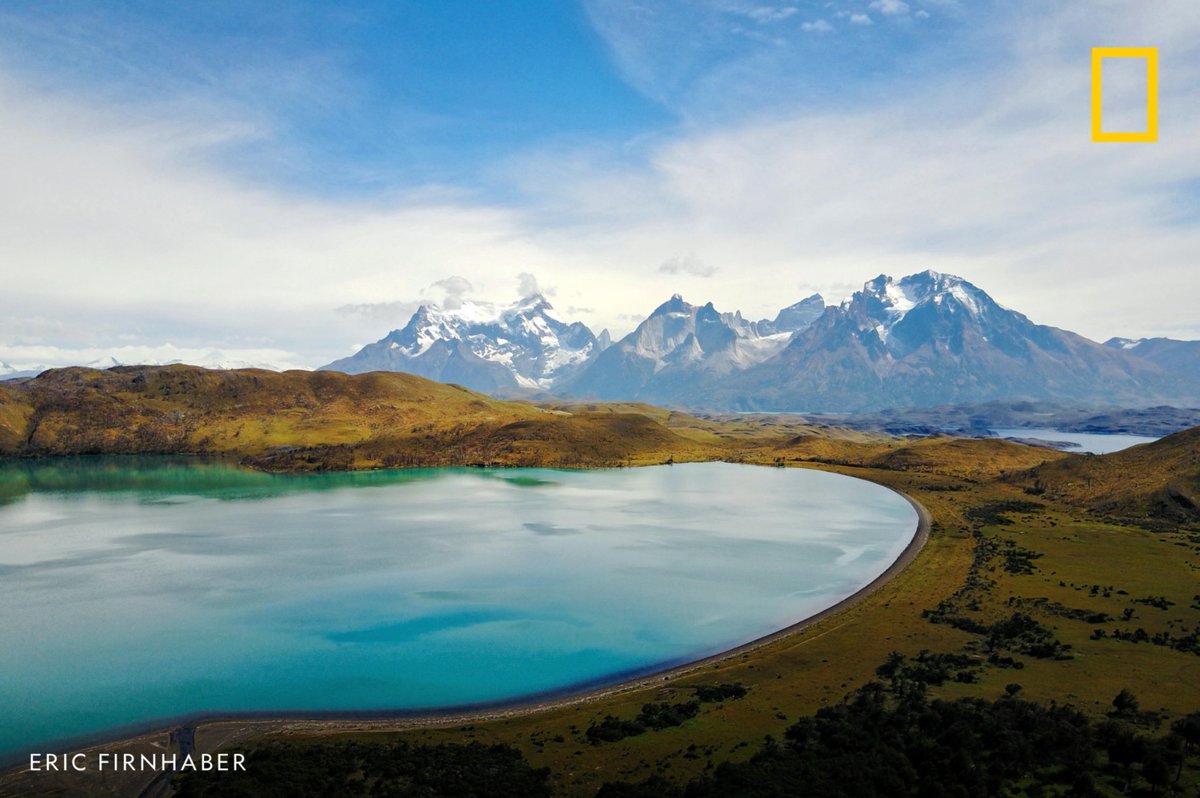 NatGeo's tweet photo. High above Chile, clear skies and a bright blue lake offer a picture-perfect glimpse of Patagonia's beauty. https://t.co/Rz1va2Q2jf