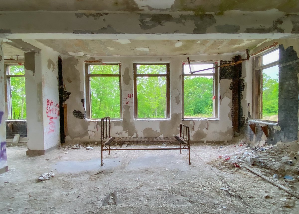 NorwichState's tweet photo. The Mitchell building is a colonial revival,  built in 1924 & is the twin to the Gallup building. They housed the well behaved male and female patients for half a century, until  the beginning of deinstitutionalization. 

In Sept of 1949, a hydrotherapy unit was added to Mitchell and Gallup, allowing for ease of access to therapeutic treatment. 

10% of Mitchell sits in the city of Norwich, next to the Lippitt building. Thames River Place, LLC., did not seek interest in its right and signed full ownership over to Preston Redevelopment Agency. 

The beds shown in the photos still sit in Mitchell and you can still take a walk through a section of the tunnel system from the basement of Gallup. (Accessing these buildings is illegal).

Mitchell and Gallup have both been abated and gutted, and are the last of three buildings awaiting demolition. 

#norwichstatehospital