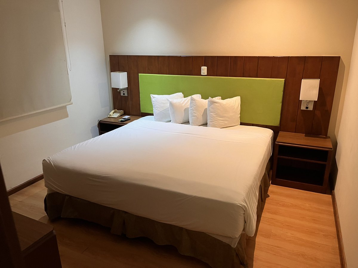 Radisson Country Inn &amp; Suites, San Jose, Costa Rica.
Plug by bed, free instant wifi, great shower, no biscuits