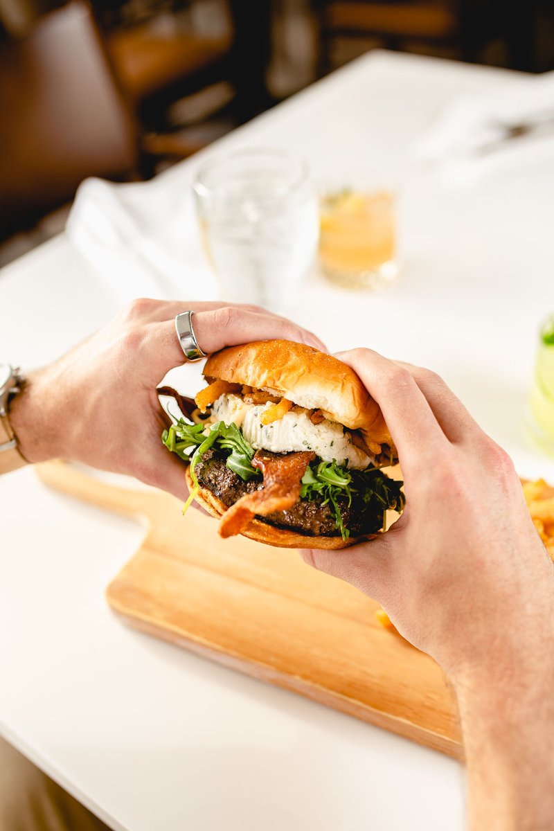 Meet our Exotic Burger: a powerhouse of bison, elk, wagyu, and wild boar topped with applewood smoked bacon, truffle arugula, fried onion, Boursin cheese, and tabasco aioli - this burger takes two hands to handle 🍔