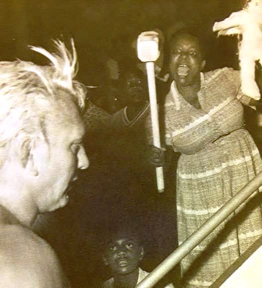Here 's a woman putting a hex on "Nature Boy" Buddy Rogers as he walks back to the dressing room. She's using supernatural powers to cause pain to Mr. Rogers, who loved getting that kind of heat. It meant he was doing his job right.    (Credit: <a href="/WrestlingIsKing/">Rasslin' History 101</a>)