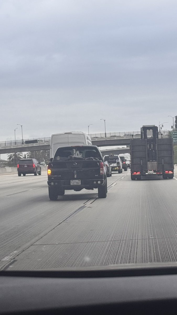 zelnayel's tweet photo. Disgusted by this Nissan Frontier driving on the I-5S through Anaheim this morning around 7:50 am for animal endangerment. They carried a crate covered in plastic and a puppy trying to escape. A report filed w/ CHP as I was afraid of puppy jumping on the freeway https://t.co/fOAM9cEn35