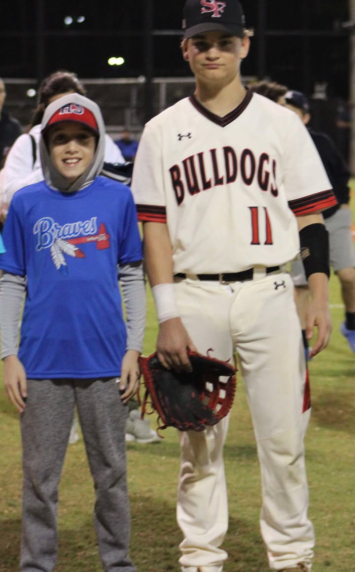 MCSDFlorida's tweet photo. BULLDOG SPIRIT🖤❤️

After meeting at Little League Night, @wearesouthfork senior Easton Podbeusek promised to attend Jace Ljongquist’s game—and he did! 🥹

Jace returned the favor by cheering Easton on at his final high school game. Special memories are made here in the MCSD! https://t.co/Lg9vt48sI3