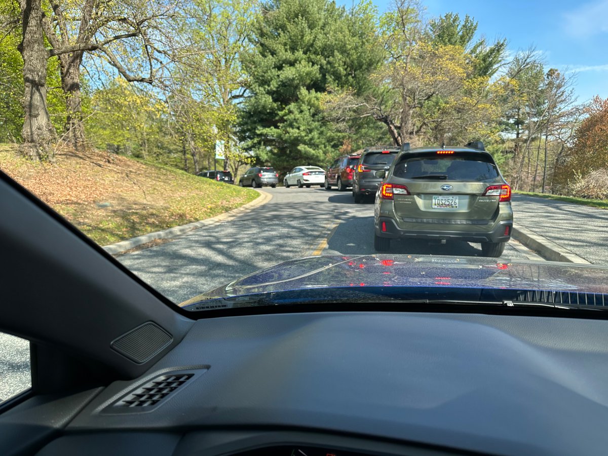 Grahamers2002's tweet photo. @marylandzoo WTF is wrong with parking this morning?  Been stuck in this line that stretches out into the main road and is causing a traffic jam for 20 minutes.  I’m a faithful member for over a decade and have never seen this. https://t.co/otbWQspqK1
