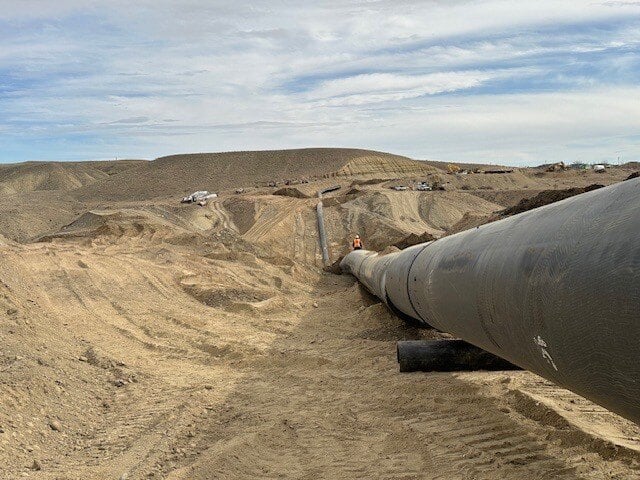 ISCOnnection - Shiprock, New Mexico - ISCO worked with the Navajo Nation to build a new irrigation system, installing 2,600 feet of 1800 MM DR21 HDPE.  Our field technicians used the immense McElroy Talon to fuse the massive pipe.  Leak-free HDPE pipe is the perfect solution.