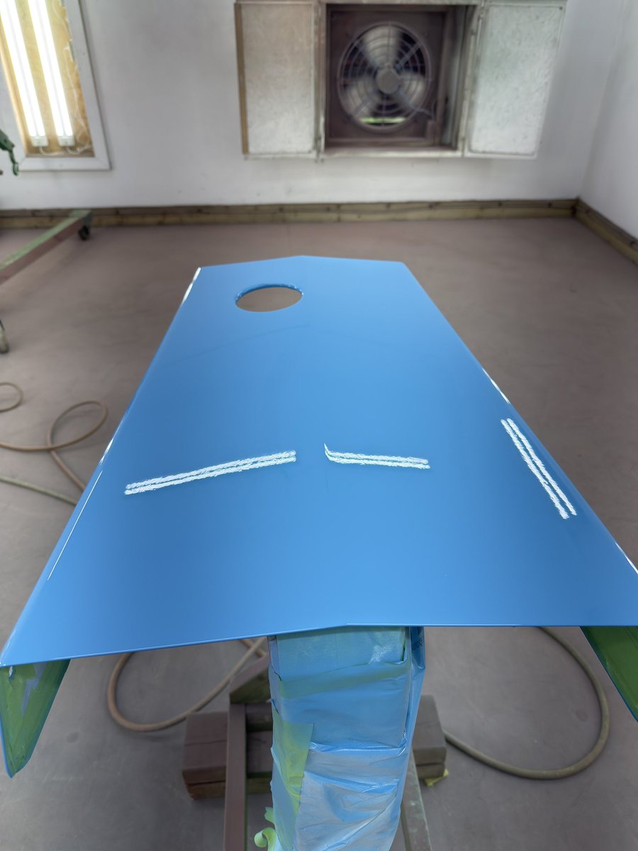 Big job in the booth today a white garden tractor hood we painted for a long time family friend.