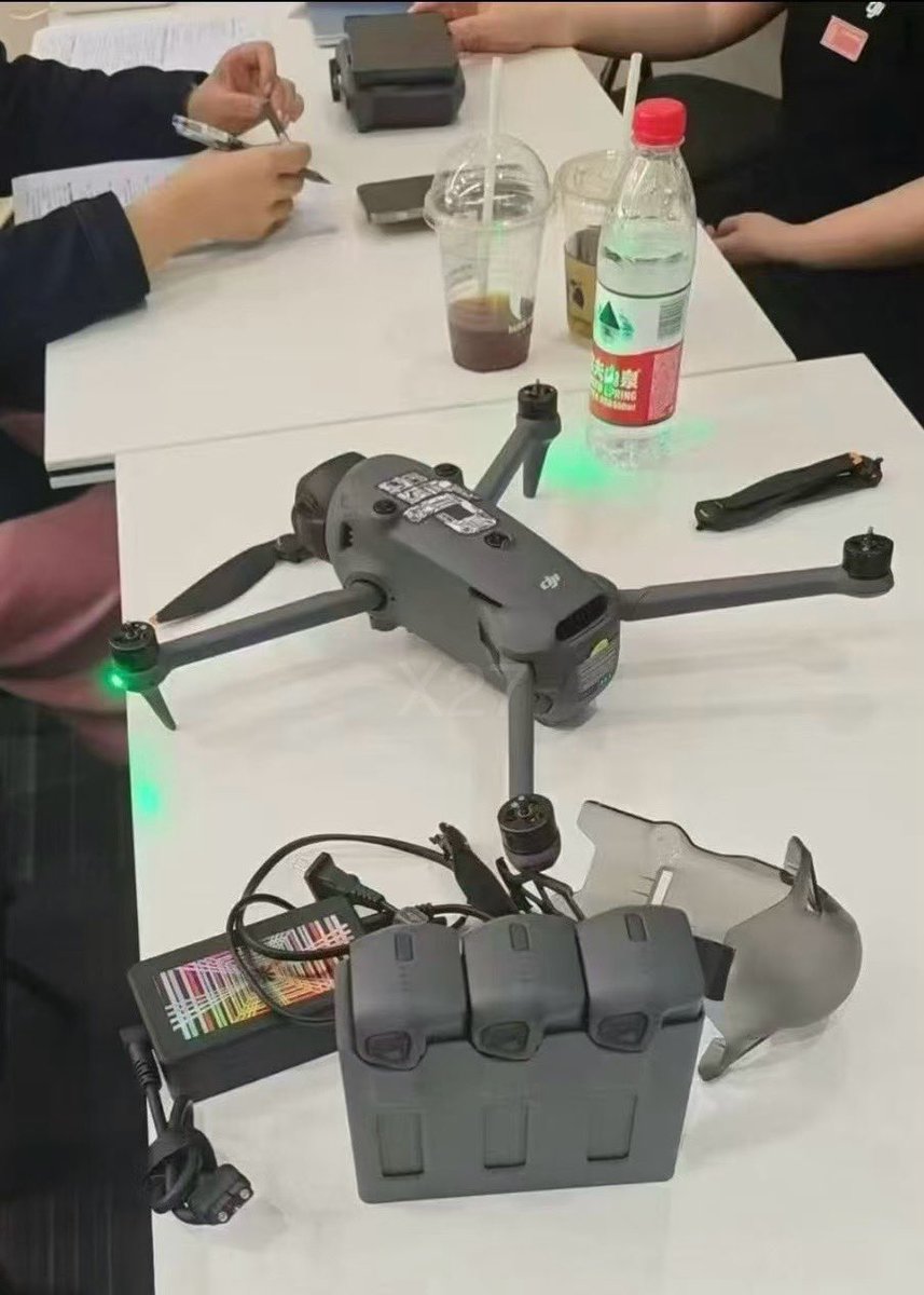 JasperEllens's tweet photo. While I am still waiting on the official specs... today we see another #Mavic4pro and #RCpro2 leaked and photographer during a employee training. First look on the parallel charger the enormous #gimbalprotector. Cheers https://t.co/1Occ8dSgtW