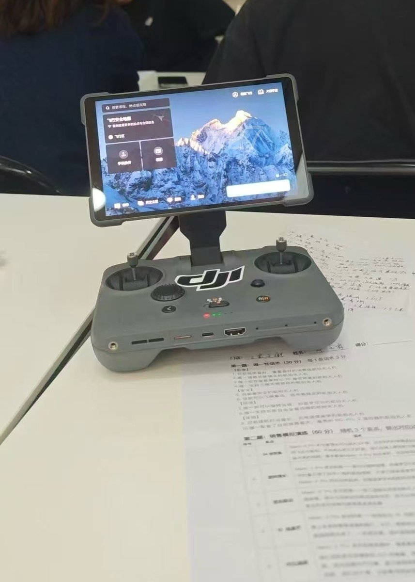 JasperEllens's tweet photo. While I am still waiting on the official specs... today we see another #Mavic4pro and #RCpro2 leaked and photographer during a employee training. First look on the parallel charger the enormous #gimbalprotector. Cheers https://t.co/1Occ8dSgtW