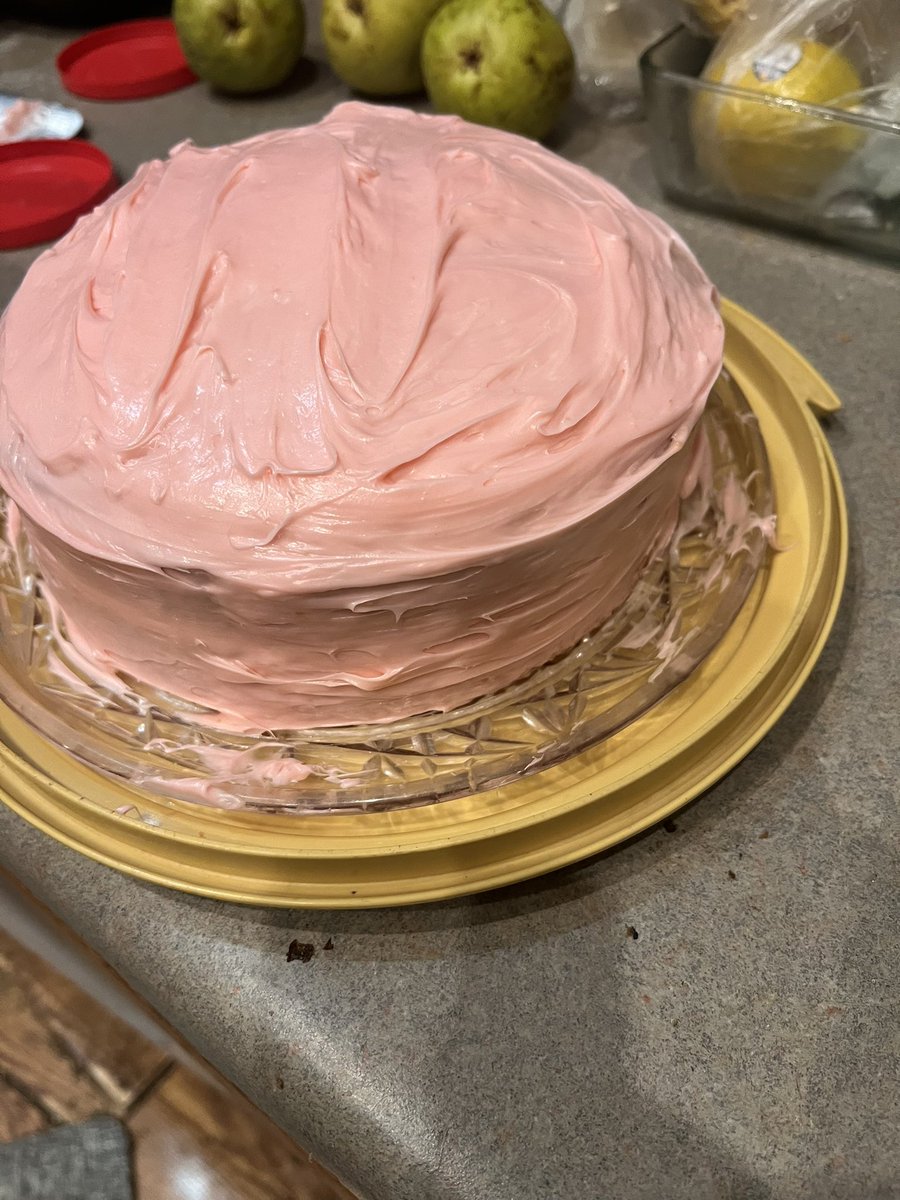 A simple two layer strawberry cake with fresh strawberry slices in the middle. Tasted great just need practice on decorating