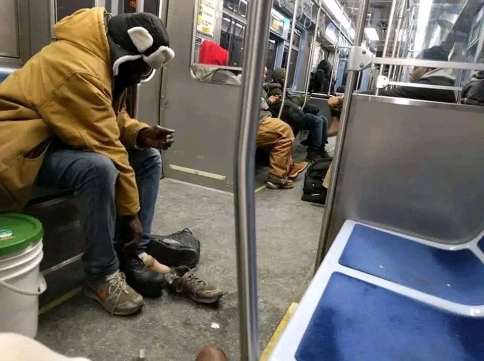 ""So, I'm headed home on the CTA Redline and there's a homeless man sitting across from me. He's older, weathered, minding his own business. His feet are so swollen he's wearing the tattered gym shoes he has with the back folded down; like slip-ons. I don't know how many pairs of